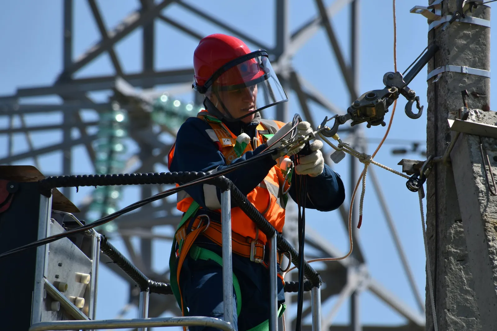 Electrician performing urgent repair work — illustrative stock photo, not an actual East Valley job site